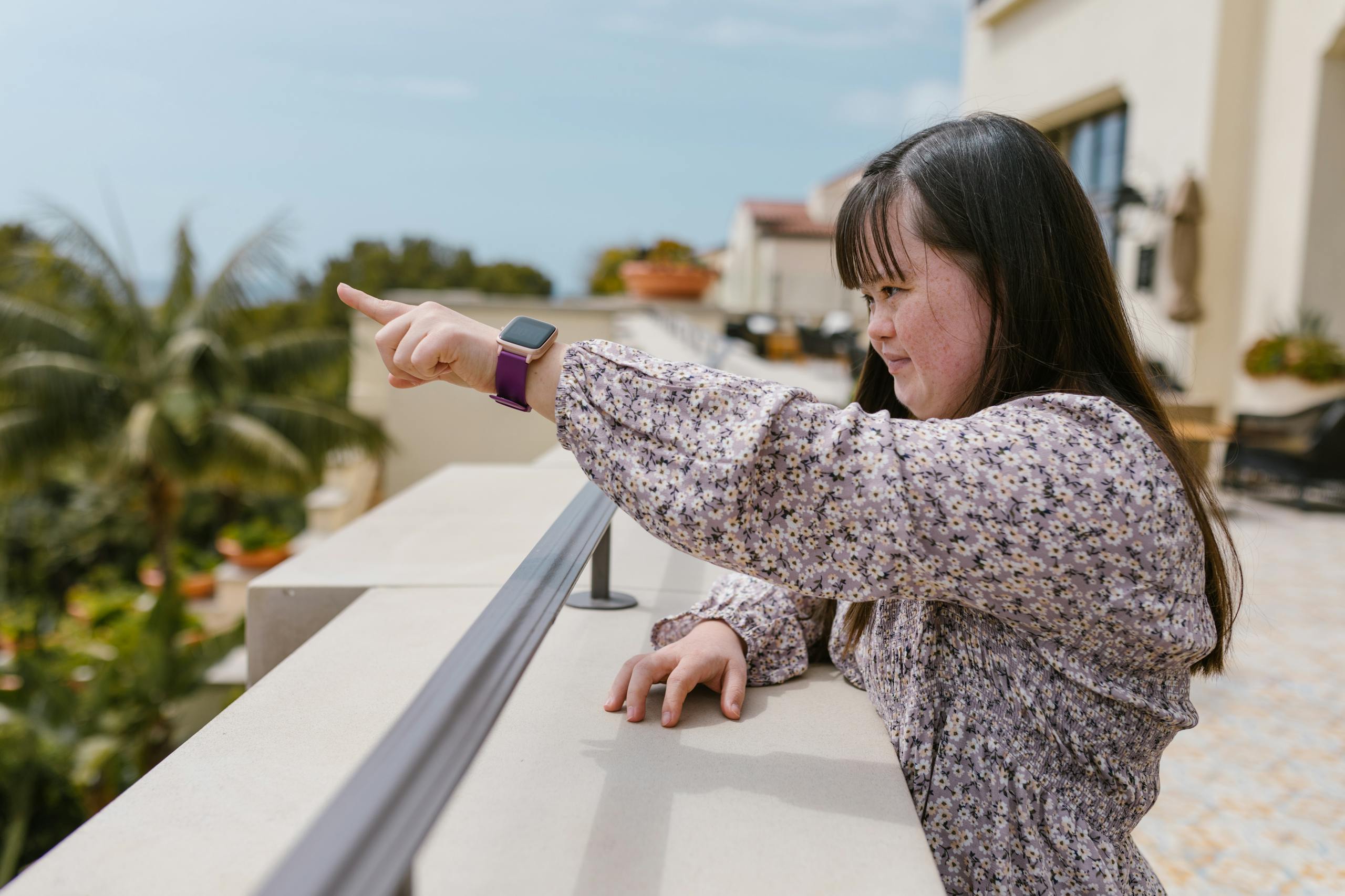 A female with visible signs of an intellectual disability Pointing Her Finger