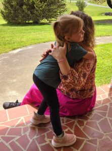 Katie Smith and her three-year-old niece hug.