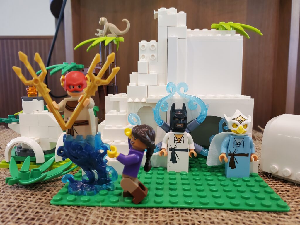 Lego sculpture of Mary encountering two angels and Jesus outside the tomb on Easter morning.