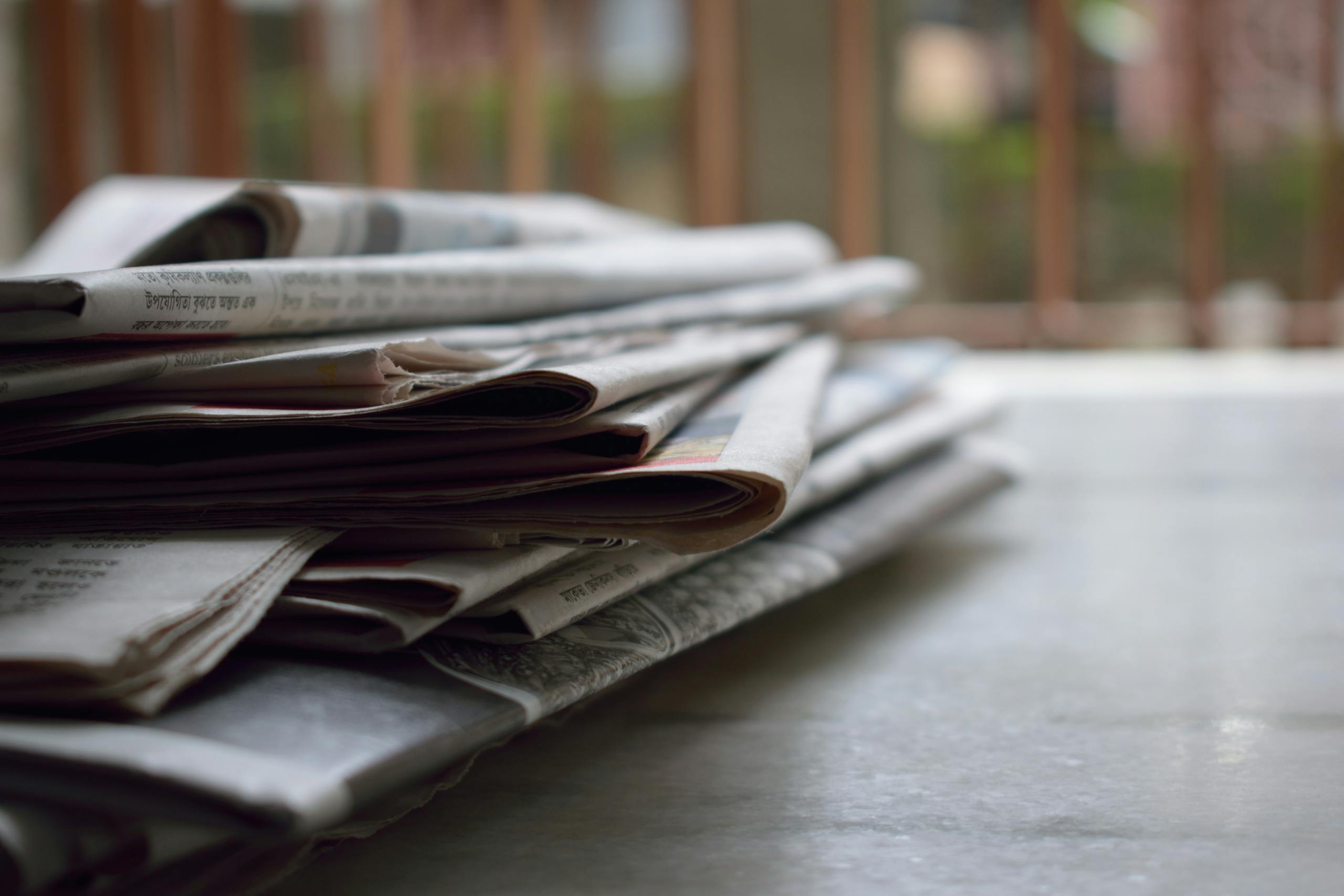 stack of newspapers and magazines